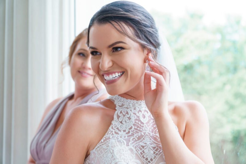 Smiling bride glowing and feeling beautiful on her wedding day